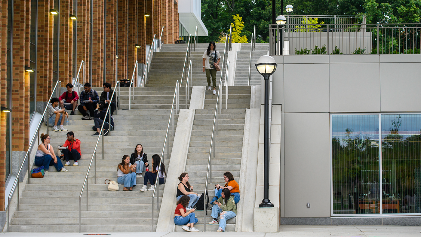 Picture of people sitting on an outdoor staircase on the University of Michigan North campus